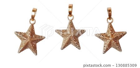 Shiny golden star charms on black background 130885309