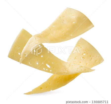 Pieces of cheese falling on a white background. Isolated 130885711