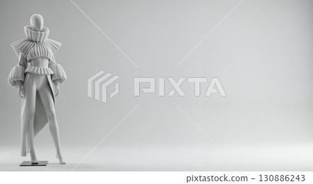 A striking minimalist display of a white mannequin showcasing a high-fashion, avant-garde outfit with ruffled details, voluminous sleeves, and a long skirt, set against a clean grey studio background. 130886243