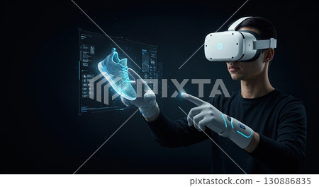 A person wearing a virtual reality headset and haptic gloves interacts with a glowing blue holographic sneaker model and digital interface in a dark, futuristic environment. 130886835