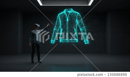 A person wearing a virtual reality headset interacts with a bright blue holographic jacket projection in a minimalist dark room with subtle ceiling lights. 130886898