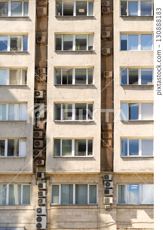 Air conditioners on the facade of the house, ventilation and cooling system. 130888183