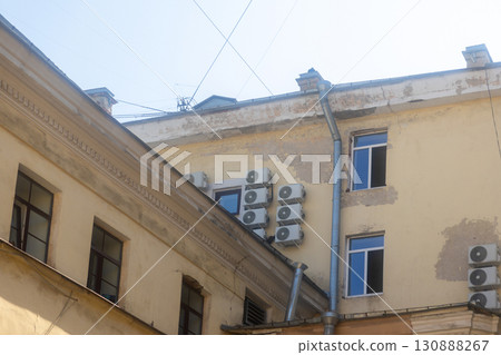 Air conditioners on the facade of the house, ventilation and cooling system. Air conditioners on the facade of the house, ventilation and cooling system. 130888267