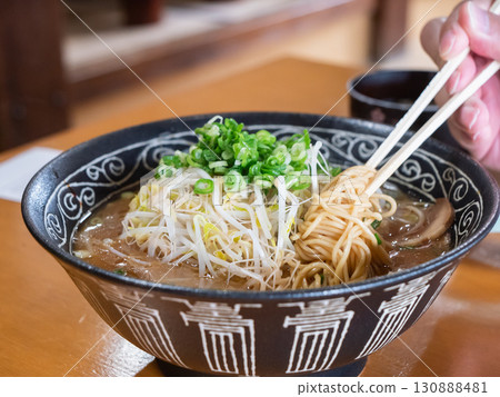 Tonkotsu soy sauce ramen with plenty of green onions and bean sprouts. 130888481
