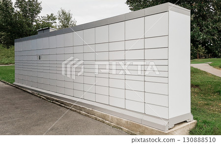 Modern outdoor parcel locker station with multiple compartments 130888510