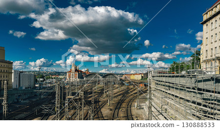 Railway station with multiple train tracks under a dramatic sky filled with clouds Railway station with multiple train tracks under a dramatic sky filled with clouds 130888533