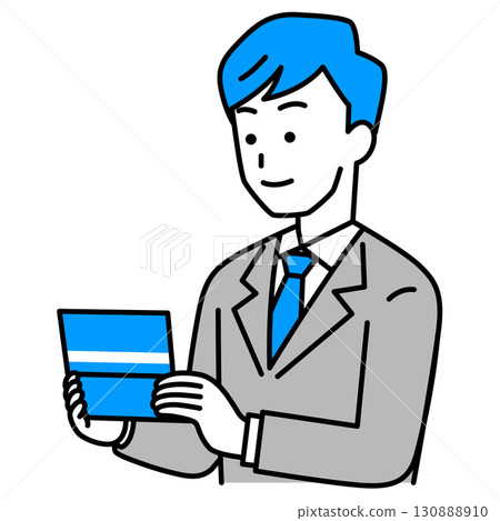 A man in a suit looking at his bankbook 130888910
