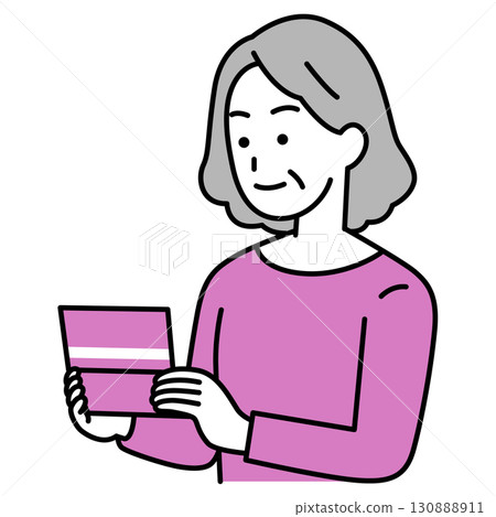 Elderly woman looking at her bankbook Elderly woman looking at her bankbook 130888911