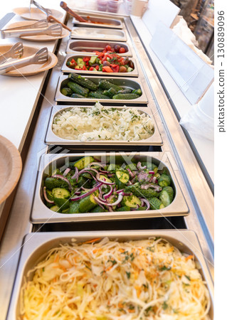 Assorted fresh vegetable salads and other buffet snacks. Assorted fresh vegetable salads and other buffet snacks. 130889096