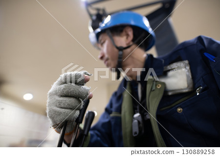 Man driving a forklift in a refrigerated warehouse 130889258