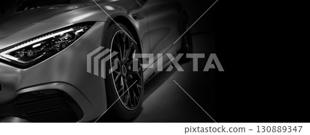 Front view of LED headlights sport car on black background Front view of LED headlights sport car on black background 130889347