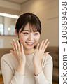 A woman who is happy to have her nails done 130889458