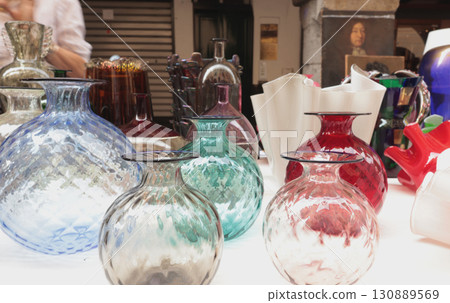 Chiaveri, Italy - September 13, 2025. Flea antique market in Europe, Italy. Old vintage items. Dishes on table in town. Retro objects for design. 130889569