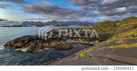 Coastal Landscape With Old Nickel Mine And Red Cottage On Senja Island At Vesteralen In Norway Coastal Landscape With Old Nickel Mine And Red Cottage On Senja Island At Vesteralen In Norway 130890423