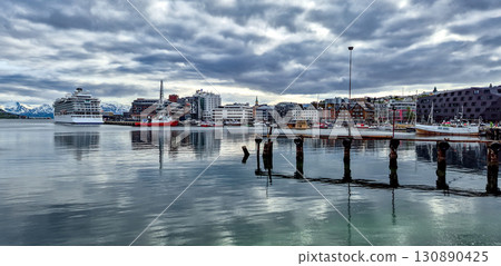 Tromso Harbor With Cruise Ship And Modern Buildings In Calm Fjord In Norway Tromso Harbor With Cruise Ship And Modern Buildings In Calm Fjord In Norway 130890425