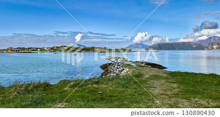 Coast With Cottages And Fjord Of Sommaroy In Norway 130890430
