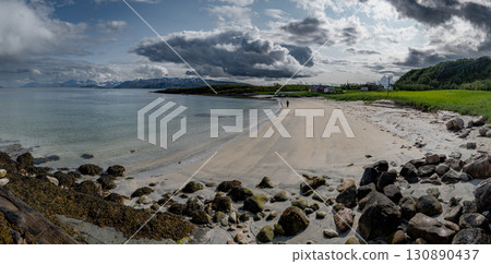 White Sand Beach With Red Cottage And Calm Fjord On Sommaroy Island In Norway White Sand Beach With Red Cottage And Calm Fjord On Sommaroy Island In Norway 130890437
