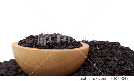 Wooden bowl filled with black rice isolated on white background, healthy organic whole grain and natural superfood ingredient. 130890451