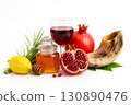 Jewish New Year, known as Rosh Hashanah, is commemorated through sacred traditions symbols including apples, honey, pomegranates, shofar. 130890476