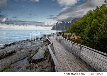 Viewpoint Tungeneset With Fjord, Mountains And Spectacular Bridge On Senja Island In Norway Viewpoint Tungeneset With Fjord, Mountains And Spectacular Bridge On Senja Island In Norway 130890593