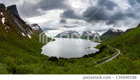 View Over Fjord With Cottages From Bergsbotn Viewing Platform On Senja Island In Norway View Over Fjord With Cottages From Bergsbotn Viewing Platform On Senja Island In Norway 130890596