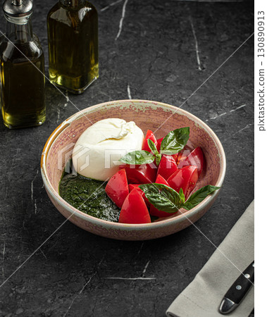 Fresh caprese salad with burrata tomato and basil Fresh caprese salad with burrata tomato and basil 130890913