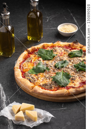 Hot mince pizza with spinach leaves and cheese 130890928