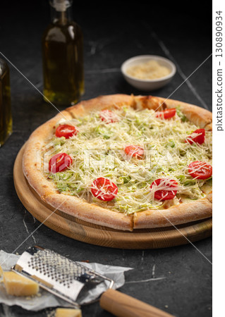 Caesar pizza with cherry tomatoes and lettuce Caesar pizza with cherry tomatoes and lettuce 130890934