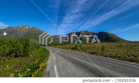 Rural Landscape With Abandoned Road And Snowy Mountains On Lofoten Islands In Norway 130891036