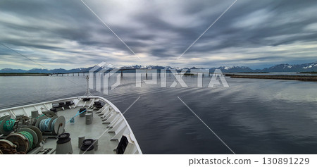 Cruise Ship Approaches High Bridge In The City Stokmarknes At The Lofoten In Norway 130891229