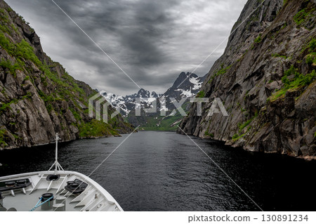 Passage Through Trollfjord With Ferry Ship At Lofoten Islands In Norway Passage Through Trollfjord With Ferry Ship At Lofoten Islands In Norway 130891234