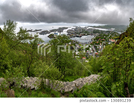 View From Hiking Path Devils Stairs To Djevelporten Over City Svolvaer On Lofoten Islands In Norway View From Hiking Path Devils Stairs To Djevelporten Over City Svolvaer On Lofoten Islands In Norway 130891239
