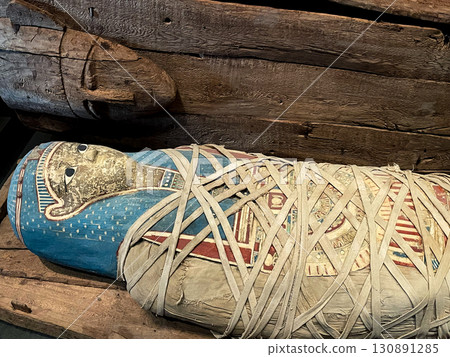 Coffins and mummy shrouds on display at the Grand Egyptian Museum in Giza 130891285