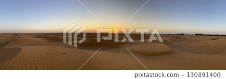 Vast golden dunes of Douz in the Tunisian desert under a clear blue sky Vast golden dunes of Douz in the Tunisian desert under a clear blue sky 130891400