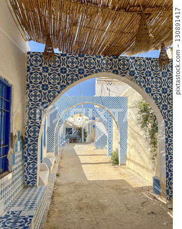 Beautifully crafted wooden door in Djerba Tunisia, showcasing traditional architecture and intricate 130891417