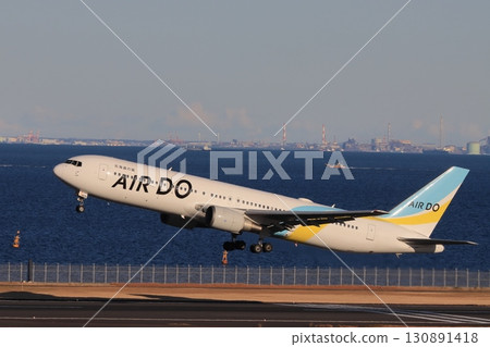 Taking off, passenger plane ascending Air Do plane taking off Taking off, passenger plane ascending Air Do plane taking off 130891418