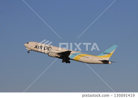 Taking off, passenger plane ascending Air Do plane taking off 130891419