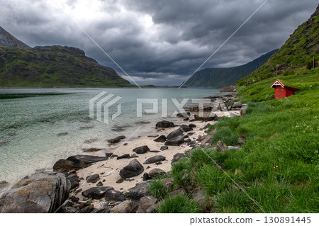 Small Red Hut On White Sand Beach On Lofoten Islands In Norway Small Red Hut On White Sand Beach On Lofoten Islands In Norway 130891445