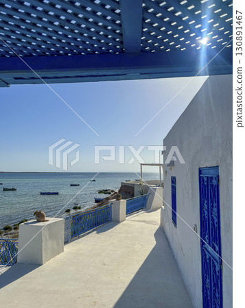 Relaxing day at a beautiful beach in Djerba, Tunisia with turquoise waters and sunny skies 130891467