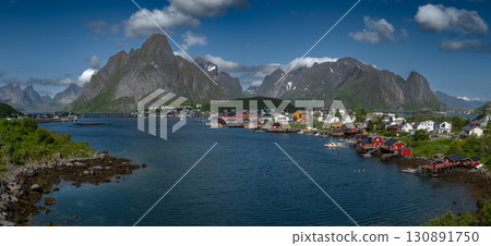 Village Reine With Mountains And Gravdalsbukta Near Reinebringen On Lofoten Islands In Norway Village Reine With Mountains And Gravdalsbukta Near Reinebringen On Lofoten Islands In Norway 130891750