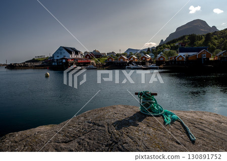 Coastal Village A I Lofoten With Harbor And Rorbuer Cabins On Lofoten Islands In Norway 130891752