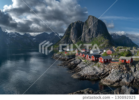 Picturesque Coastal Village Hamnoy With Red Rorbuer Huts On Lofoten Islands In Norway Picturesque Coastal Village Hamnoy With Red Rorbuer Huts On Lofoten Islands In Norway 130892025