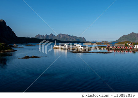 Harbor And Rorbuer Huts At Midnight Sun In Svolvaer City On Lofoten Islands In Norway Harbor And Rorbuer Huts At Midnight Sun In Svolvaer City On Lofoten Islands In Norway 130892039