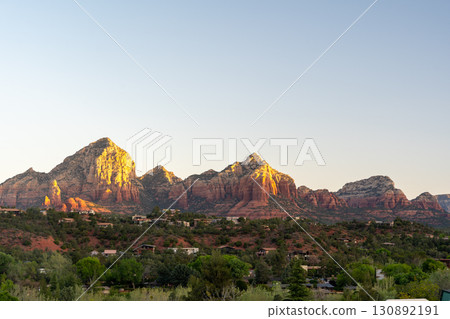 Golden sunset illuminates Sedona red rock formations and scenic desert landscape Golden sunset illuminates Sedona red rock formations and scenic desert landscape 130892191