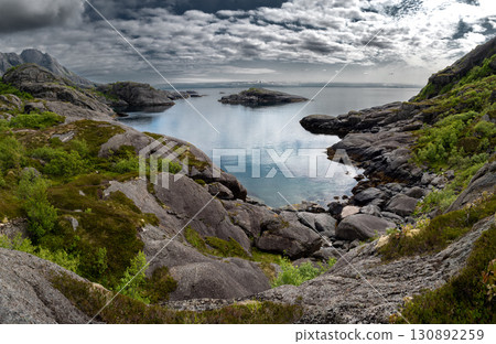 Hiking Trail At The Coast Of Nusfjord On Lofoten Islands In Norway Hiking Trail At The Coast Of Nusfjord On Lofoten Islands In Norway 130892259