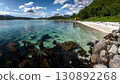 White Sand Beach And Snowy Mountains At The Fjord Cost Of Lofoten Islands In Norway 130892268