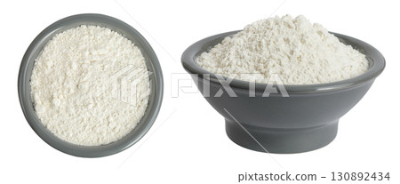 White flour in ceramic bowl isolated on white background. Top view. Flat lay. 130892434