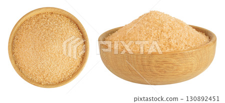 The brown sugar in wooden bowl isolated on white background. Top view. Flat lay The brown sugar in wooden bowl isolated on white background. Top view. Flat lay 130892451