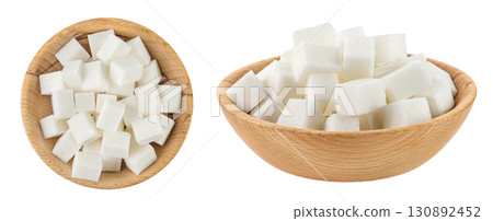Sugar cubes in a wooden bowl isolated on white background. Top view. Flat lay Sugar cubes in a wooden bowl isolated on white background. Top view. Flat lay 130892452