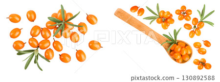Sea buckthorn. Fresh ripe berry in wooden spoon with leaves isolated on white background. Top view. Flat lay Sea buckthorn. Fresh ripe berry in wooden spoon with leaves isolated on white background. Top view. Flat lay 130892588